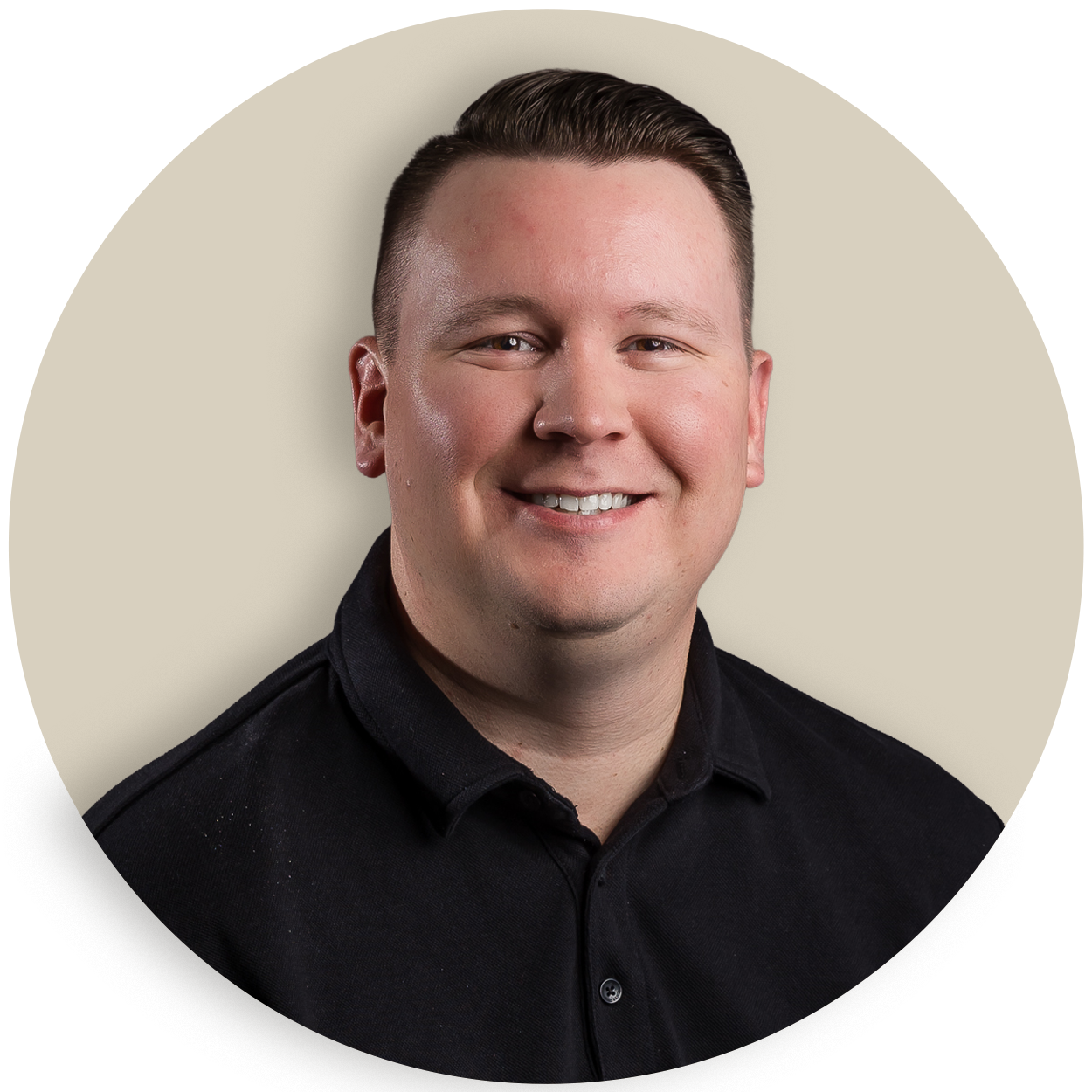Portrait of Brady Cremeens in a black shirt against a beige background