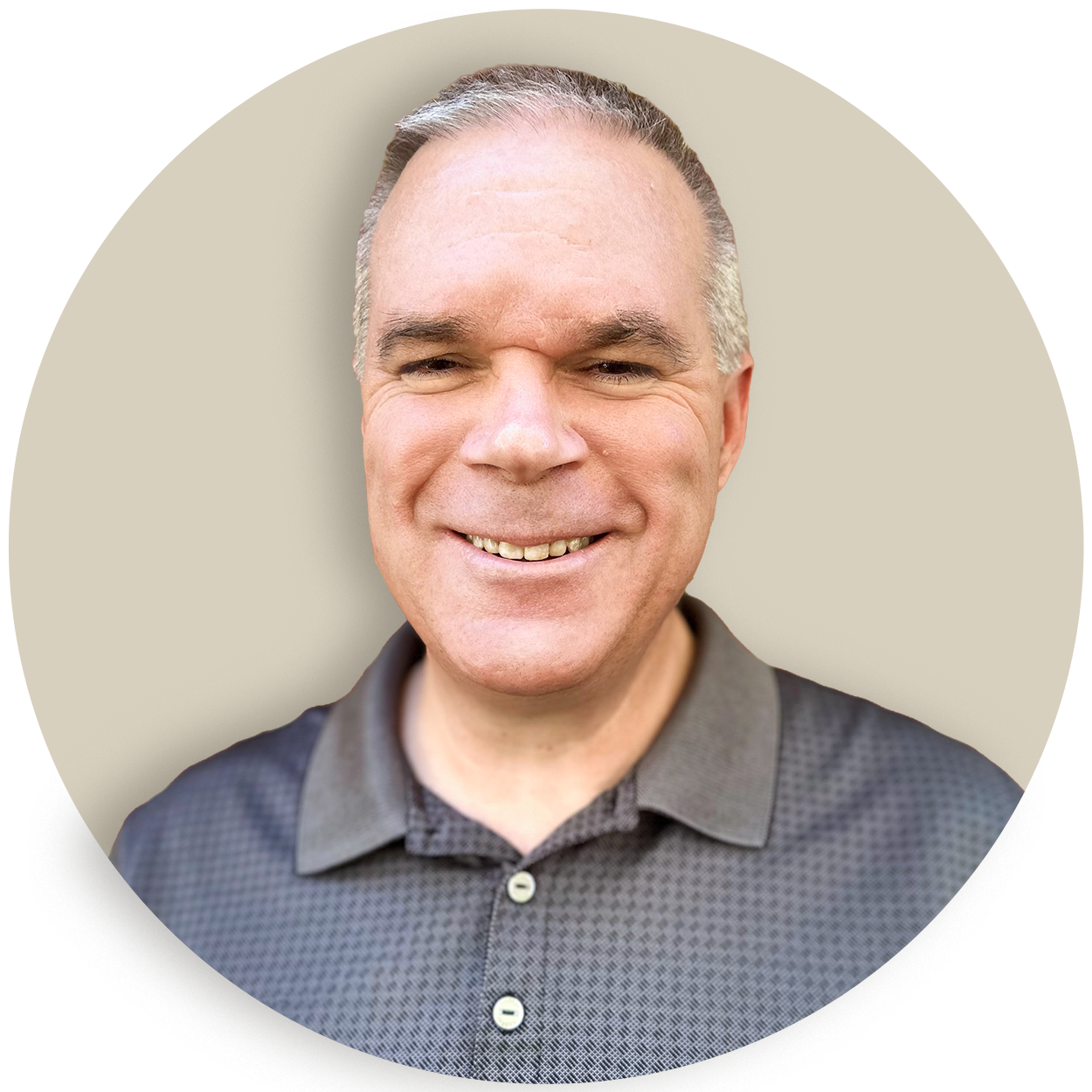 Portrait of Greg Robbins in a dark polo shirt