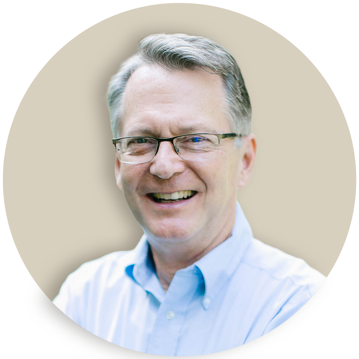Portrait of Jon Weatherly wearing glasses and a light blue shirt